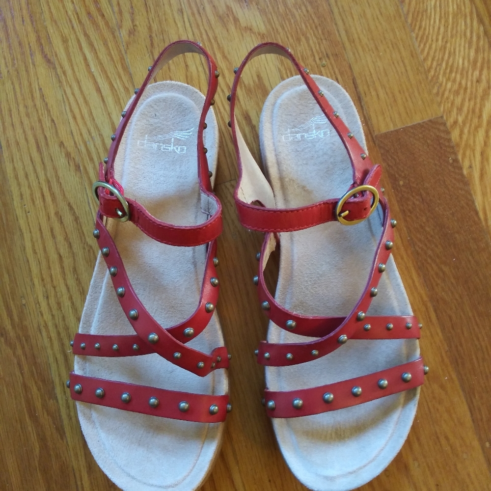 Strappy red leather Dansko sandals with studs